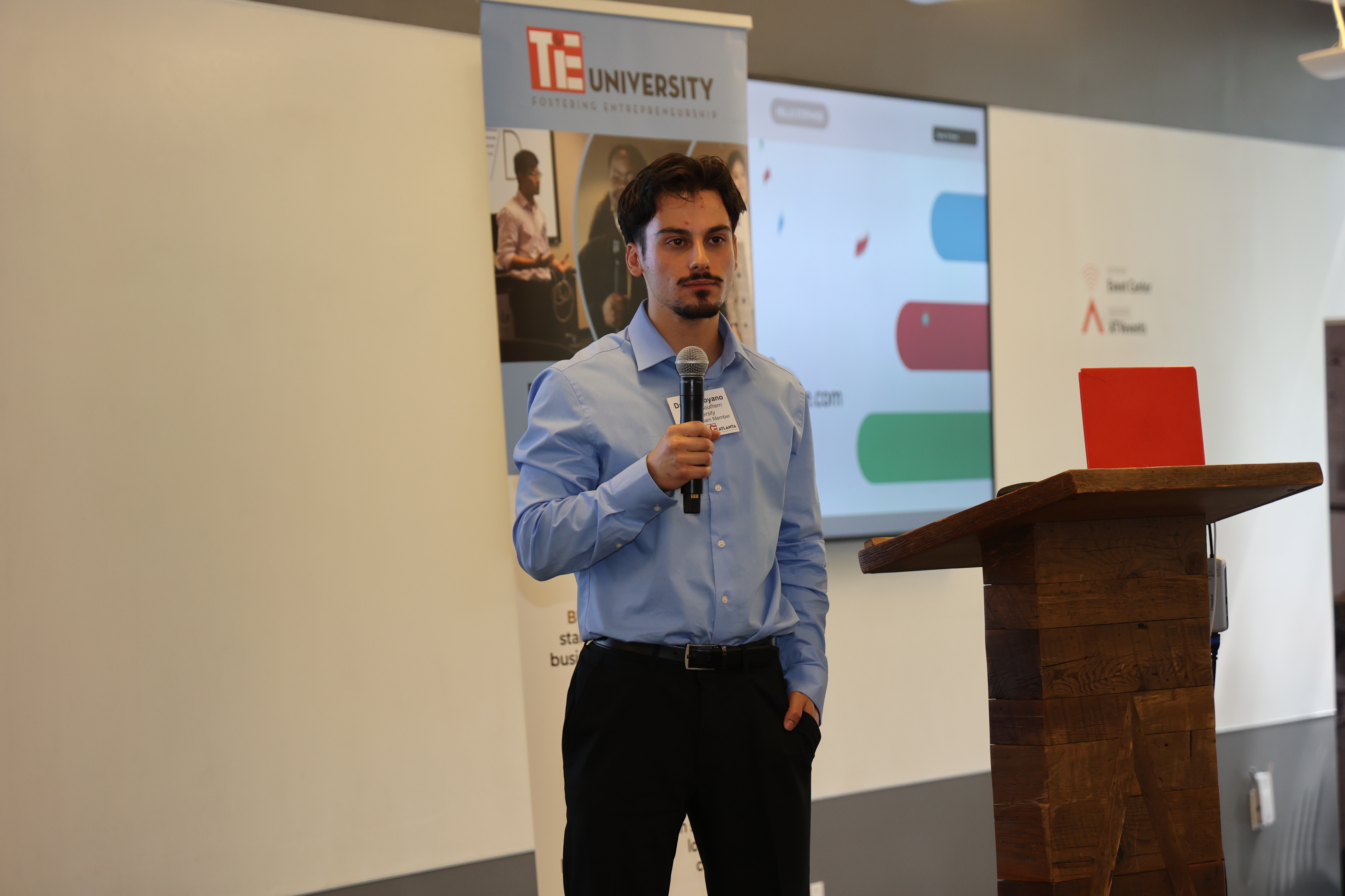 Daniel presenting Stepwise on stage at TiE Atlanta